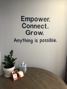 shelly stotzer brand phrase on wall of office