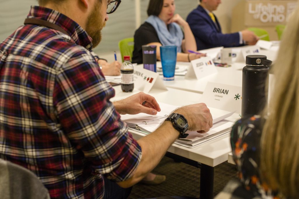 employee looking at paperwork at maximize your talent program