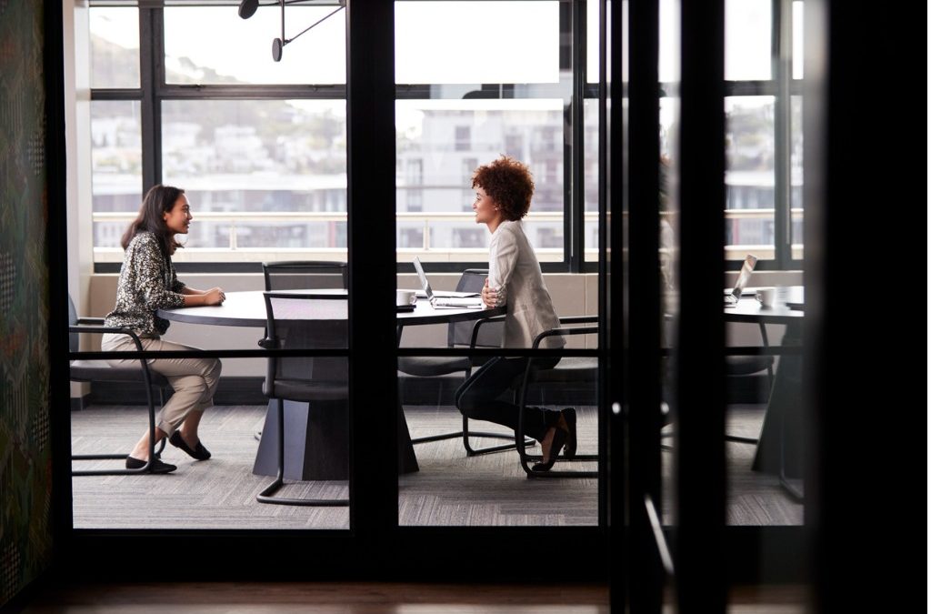 two people practicing interview skills face to face